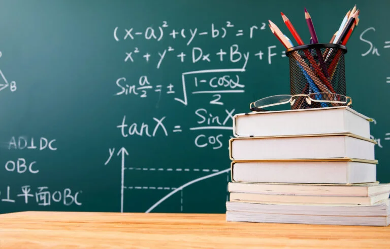 Vestibular: confira este guia e saiba tudo sobre conjuntos numéricos 8 stack books with pencil holder glasses against chalkboard