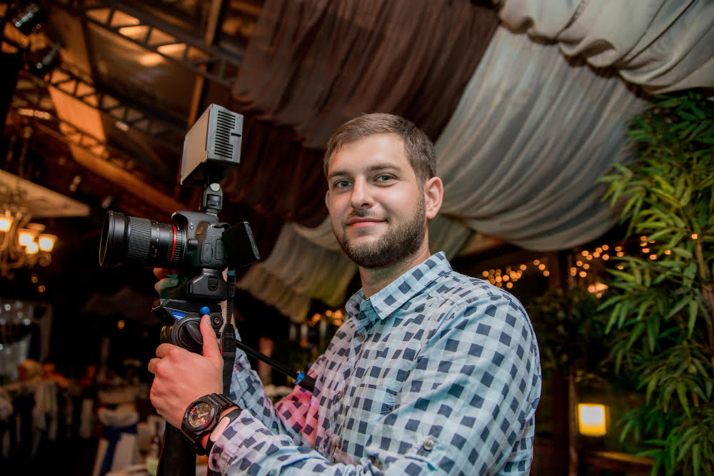 man with beard camera monopod